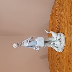 Lladro girl with basket feeding ducks